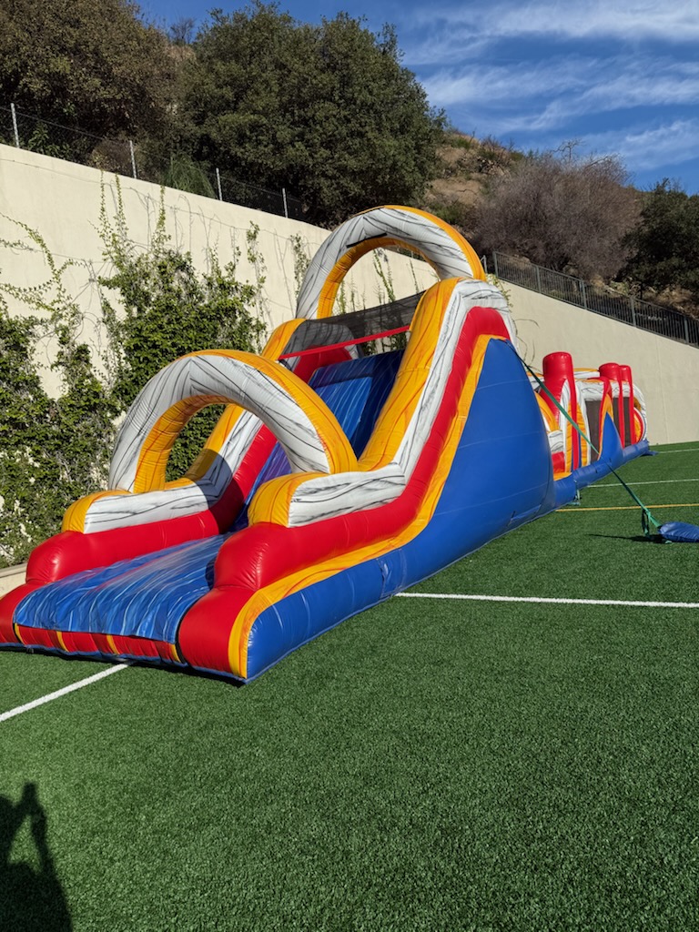 Large inflatable bounce house delivered by Locally Swift
