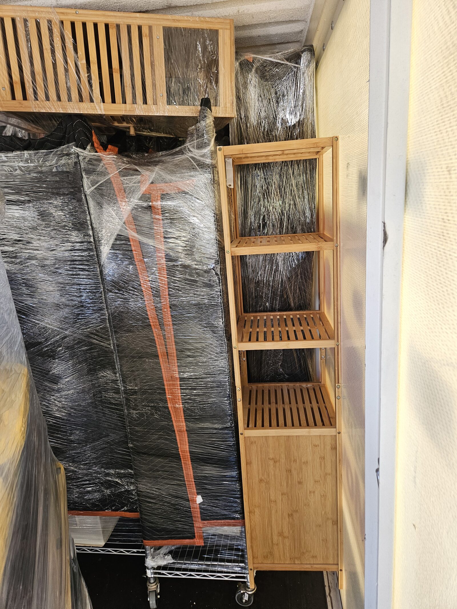 Professionally loaded storage pod with shrink-wrapped and blanket-wrapped furniture by Locally Swift
