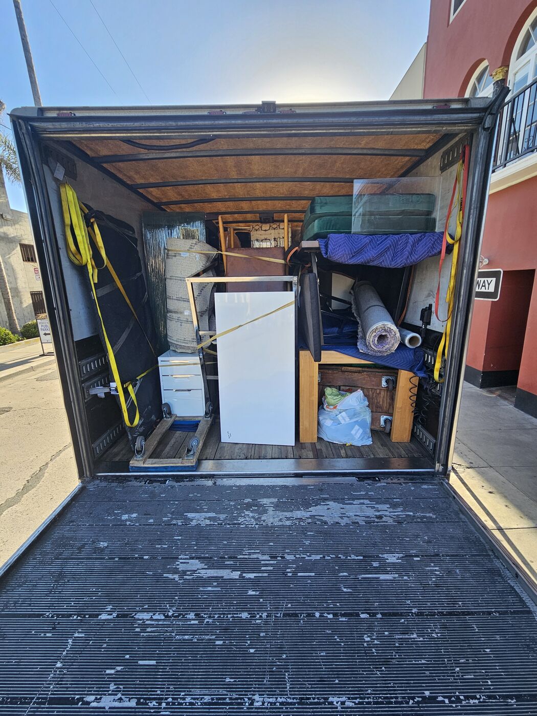 Box truck packed safely by Locally Swift professional packers with furniture strapped in tiers